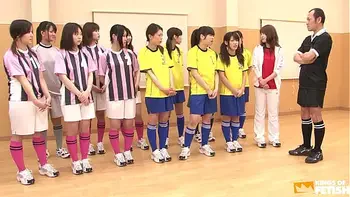 Japanese female team listen and take a lesson from their coach