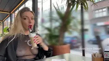 Flashing tits in cafe with glass walls so all people outside see me. Transparent t-shirt no bra.