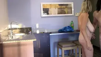 Milf fucked in kitchen gets a cumshot on her huge tits