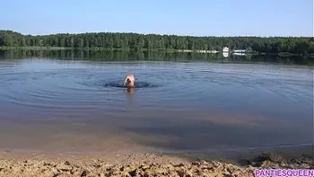 Naked girl goes skinny dipping in public beach