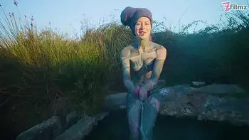 Alternative couple having wild outdoor sex in outdoor hotbath