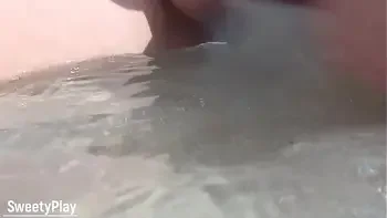 Shaved pussy peeing on public beach