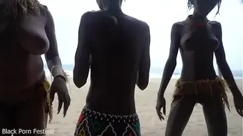 3 African tribe witches doing a dancing ritual for making rain