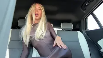 publicly in a car in a bodysuit masturbates and gets a squirt