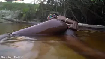 Skinny dark skinned African hottie teasing in the water