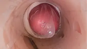 The camera in the deep pussy records a huge ejaculation of sperm into the condom