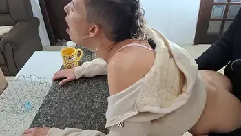 A stepdaughter is surprised while having breakfast.