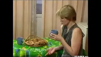 young boy takes tea with mature - M