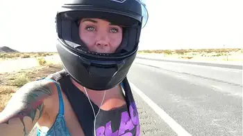 felicity feline riding on aprilia tuono motorcycle