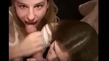 Two girls make a blowjob and kiss