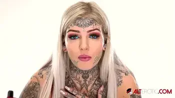 Behind the scenes for Amber Luke's new face tattoo
