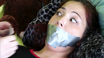 Bound and gagged on the bed