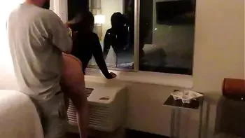 Having fun wearing a see through short dress in hotel public areas