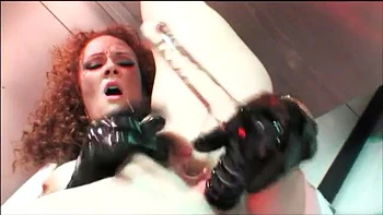 Curly haired ginger babe gets double penetrated and swallows cum