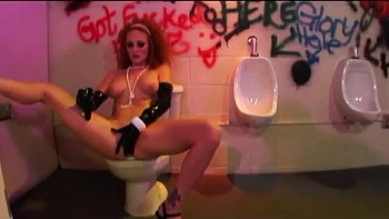 Redhead slut pounded in the public restroom
