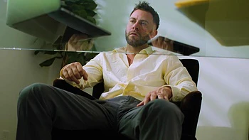 A sexy woman has sex with her boyfriend in the kitchen.