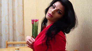 A hot brunette in sexy stockings and lingerie, teasing with her long legs.