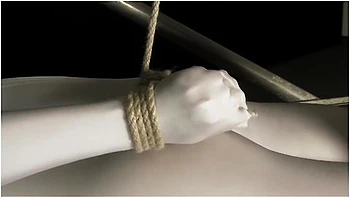 Babe Wrapped In White Zentai Suit Enjoys To Be Bondaged To A Metal Pole