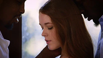 Two guys and a girl in an intense bedroom session