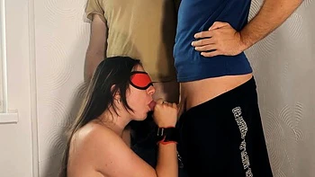 Whore Sucks Two Cocks and Swallows Cum in BDSM Threesome