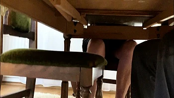 My mother in law spreads her legs under the desk