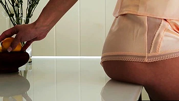 Petite blonde MILF strips in her kitchen