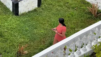 Martina is recorded from afar by a fan while she masturbates in public