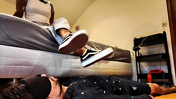 Light femdom and foot fetish play with brunette