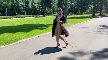 Stylish Lady walks naked in park. Public