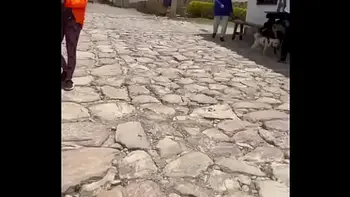 Two lesbians touch each other to orgasm on the corner of a town trying to avoid being seen by anyone