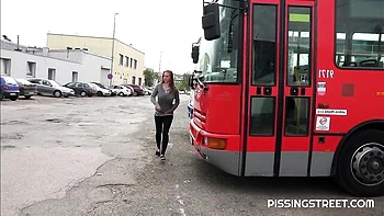 Crazy solo pissing on the pave with a hot short-haired girlfriend Suzie